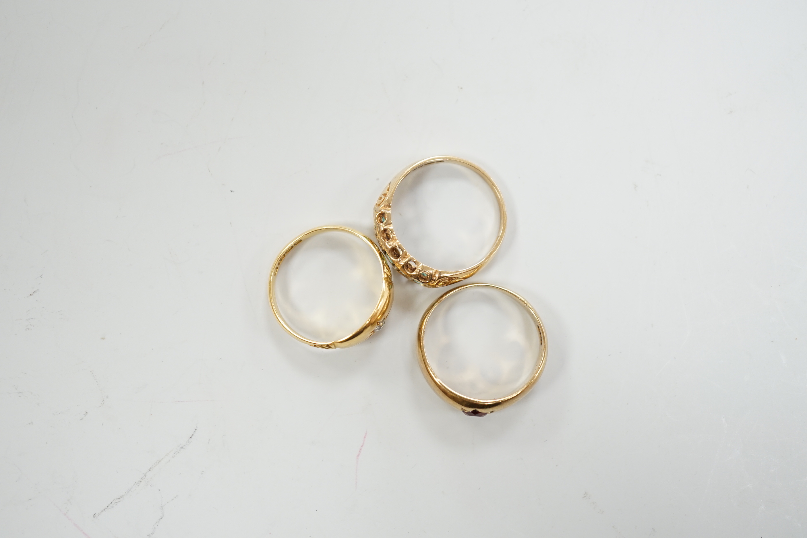 An Edwardian 18ct gold and diamond chip set ring, size M, gross weight 2.6 grams and two later 9ct gold and gem set rings, gross weight 5.5 grams.
